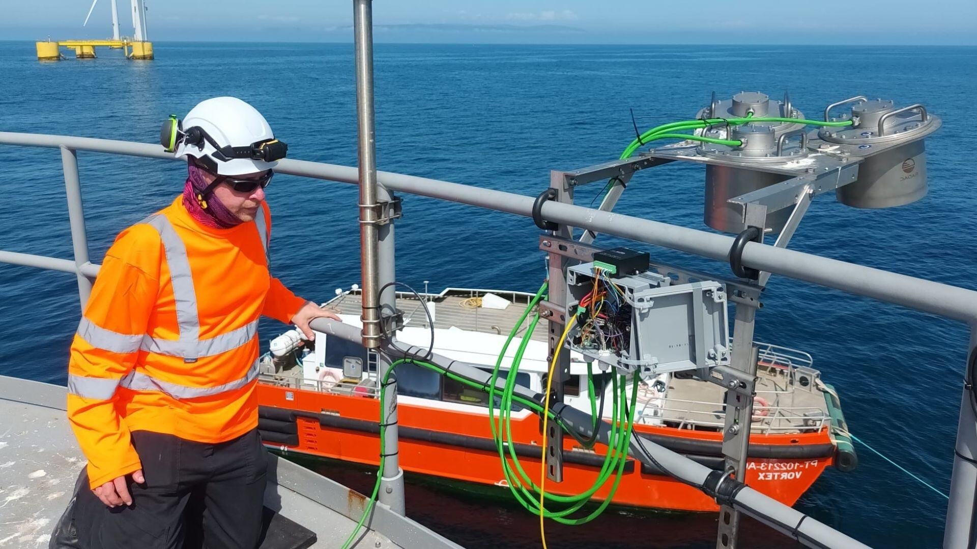 Offshore communications engineer installing a MetOcean sensor system to an offshore floating wind turbine.